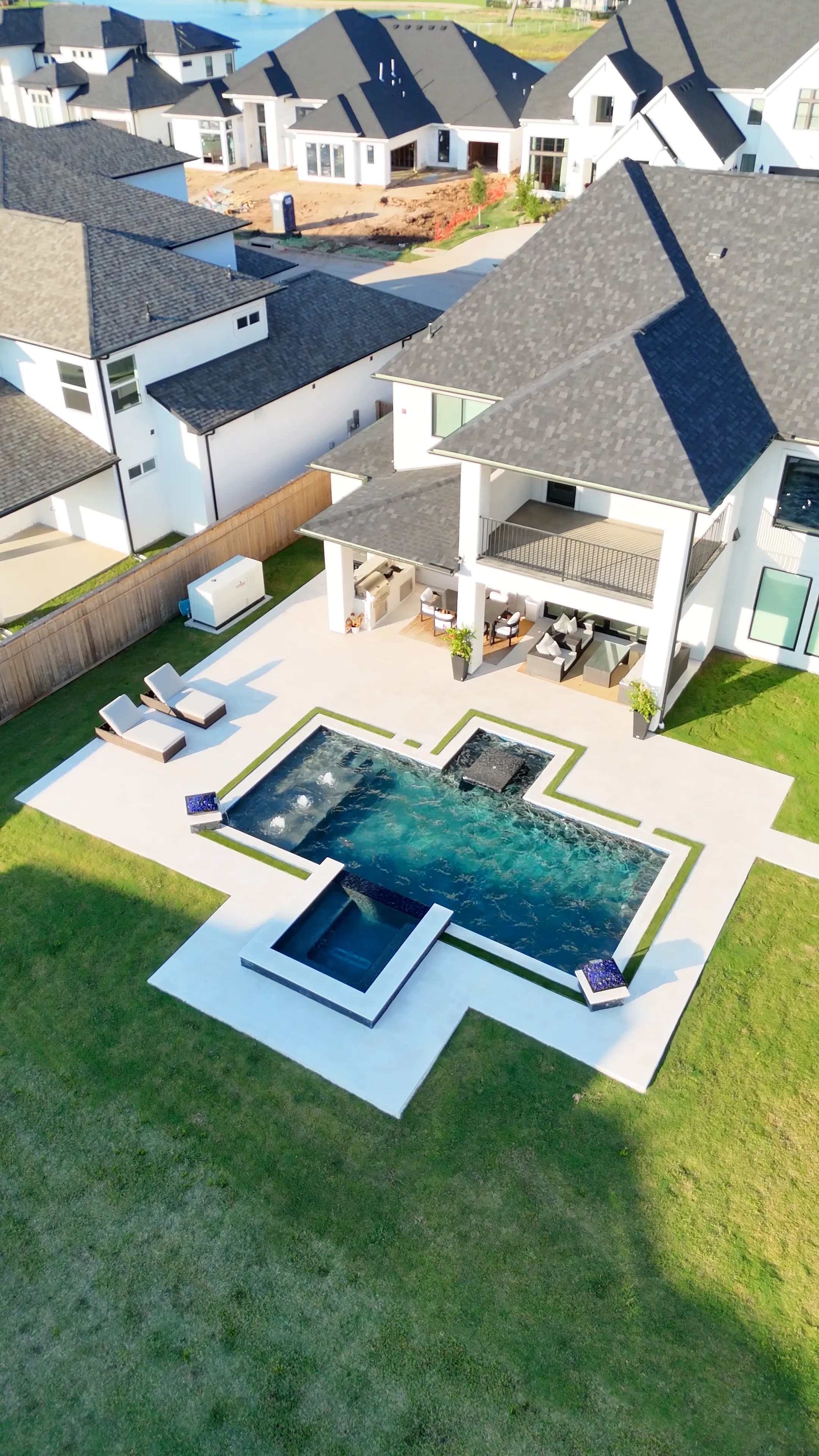 Luxury custom pool design and outdoor living space in Houston